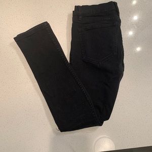 Black ripped RUDE stinger jeans.